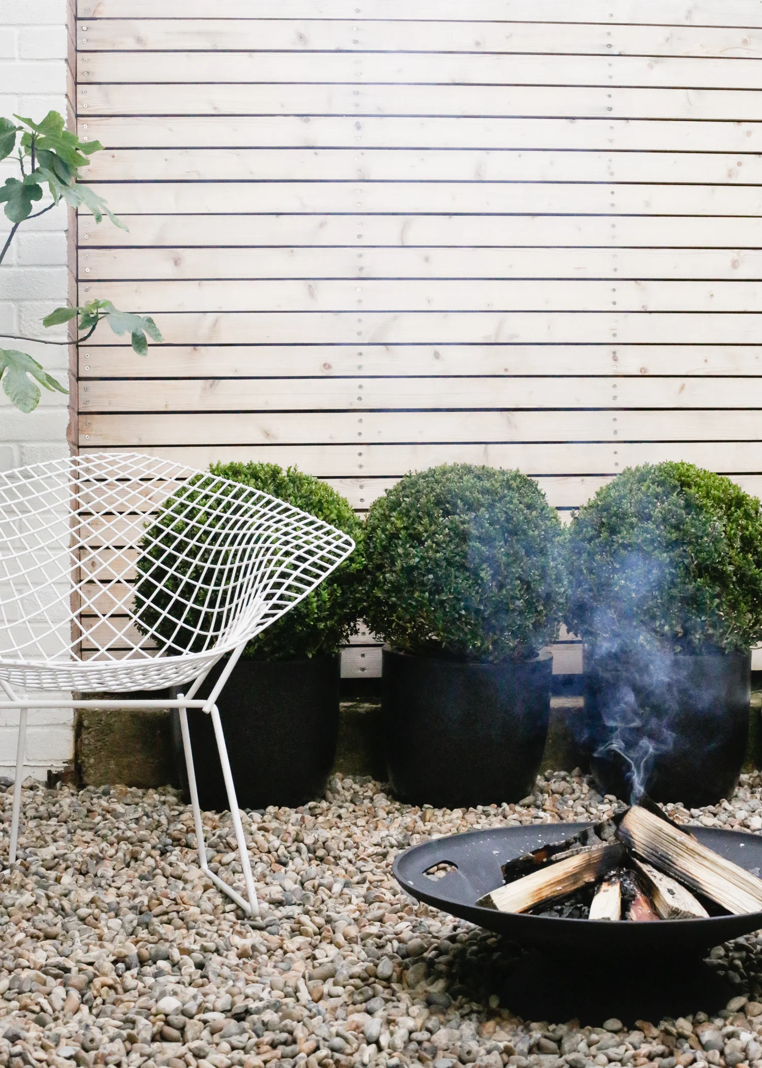 Skagerak firebowl and Bertoia chair | Design Hunter