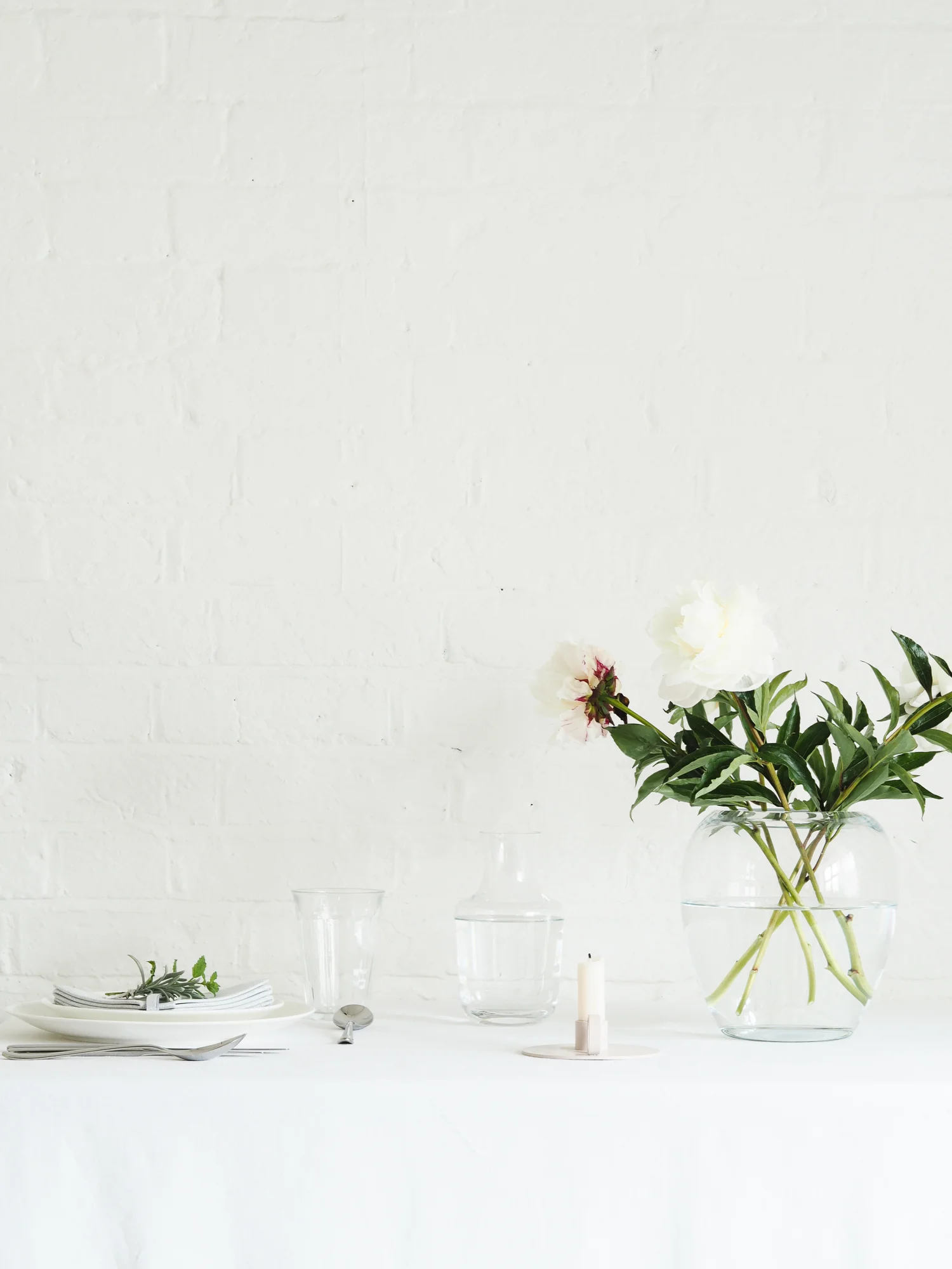 Vase of peonies on dining table | Design Hunter