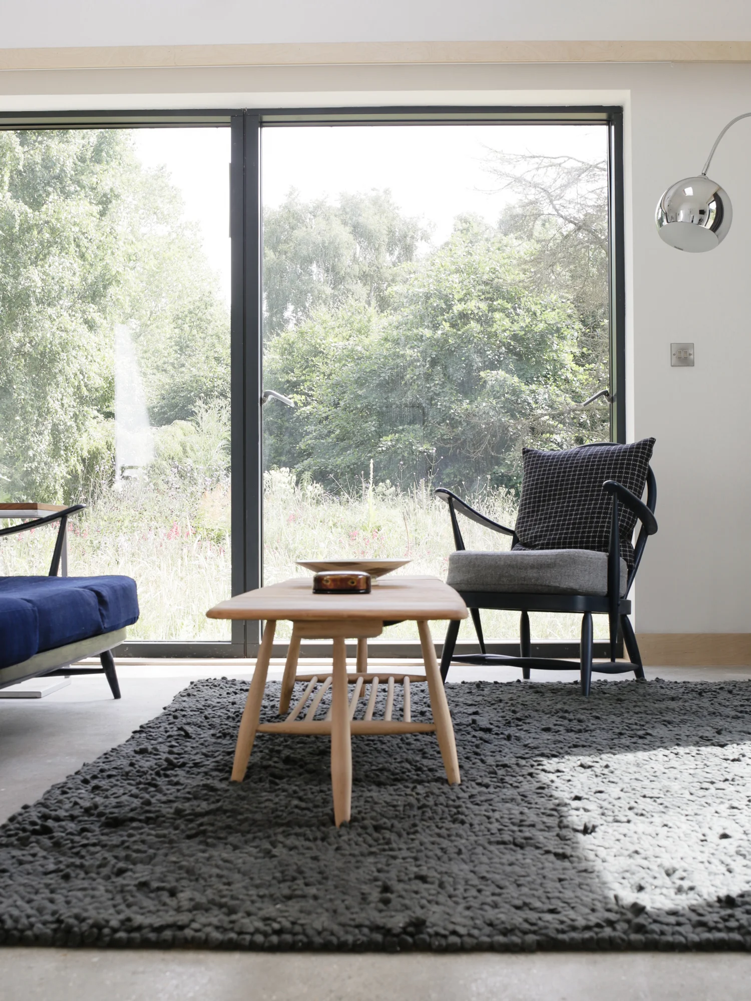 ercol chair in bedroom at Five Acre Barn | Design Hunter