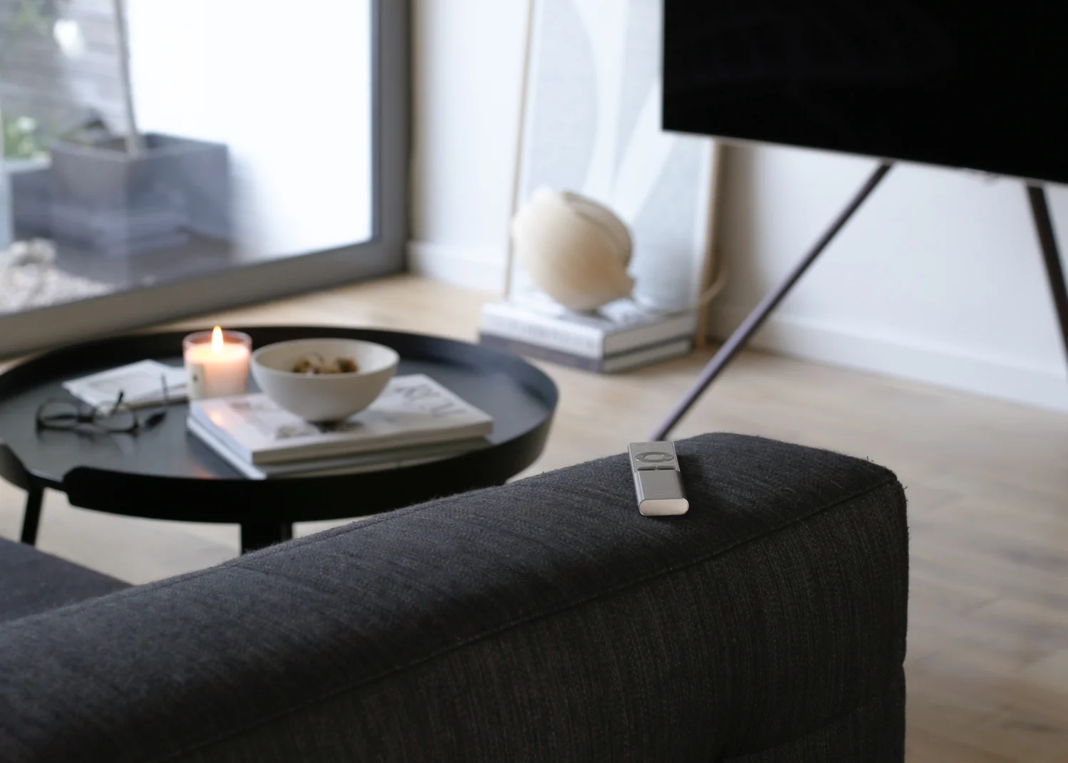 Samsung QLED TV with remote on sofa - Design Hunter-1.jpg