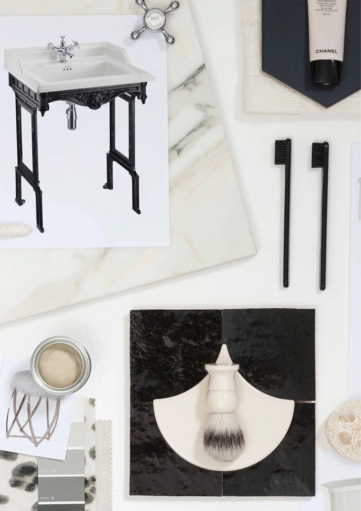 Black accents complement the warm ivory finish of the ceramics to create a classic monochrome look created by Burlington Bathrooms.