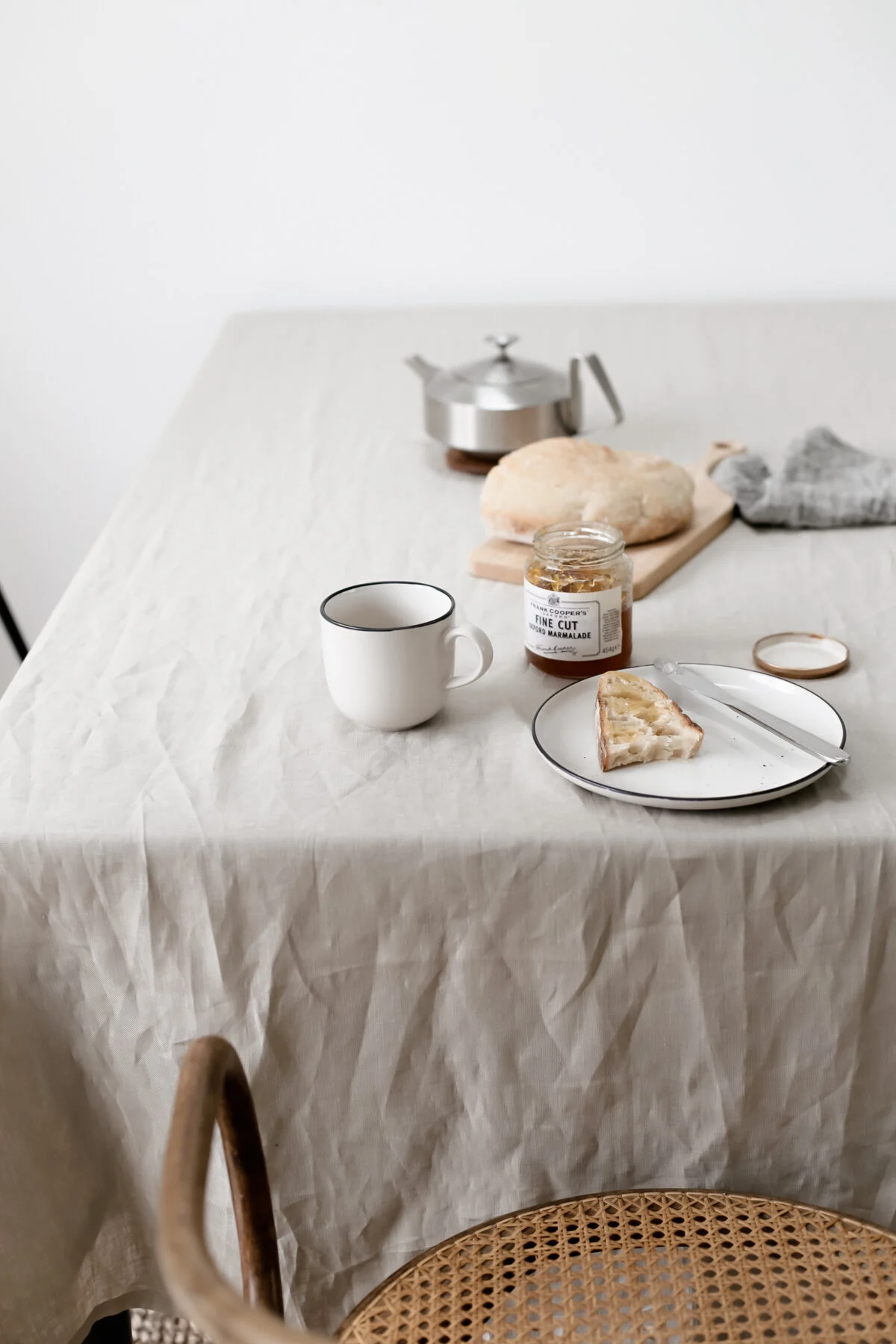 Breakfast table with linen tablecloth and Thonet chair.jpg