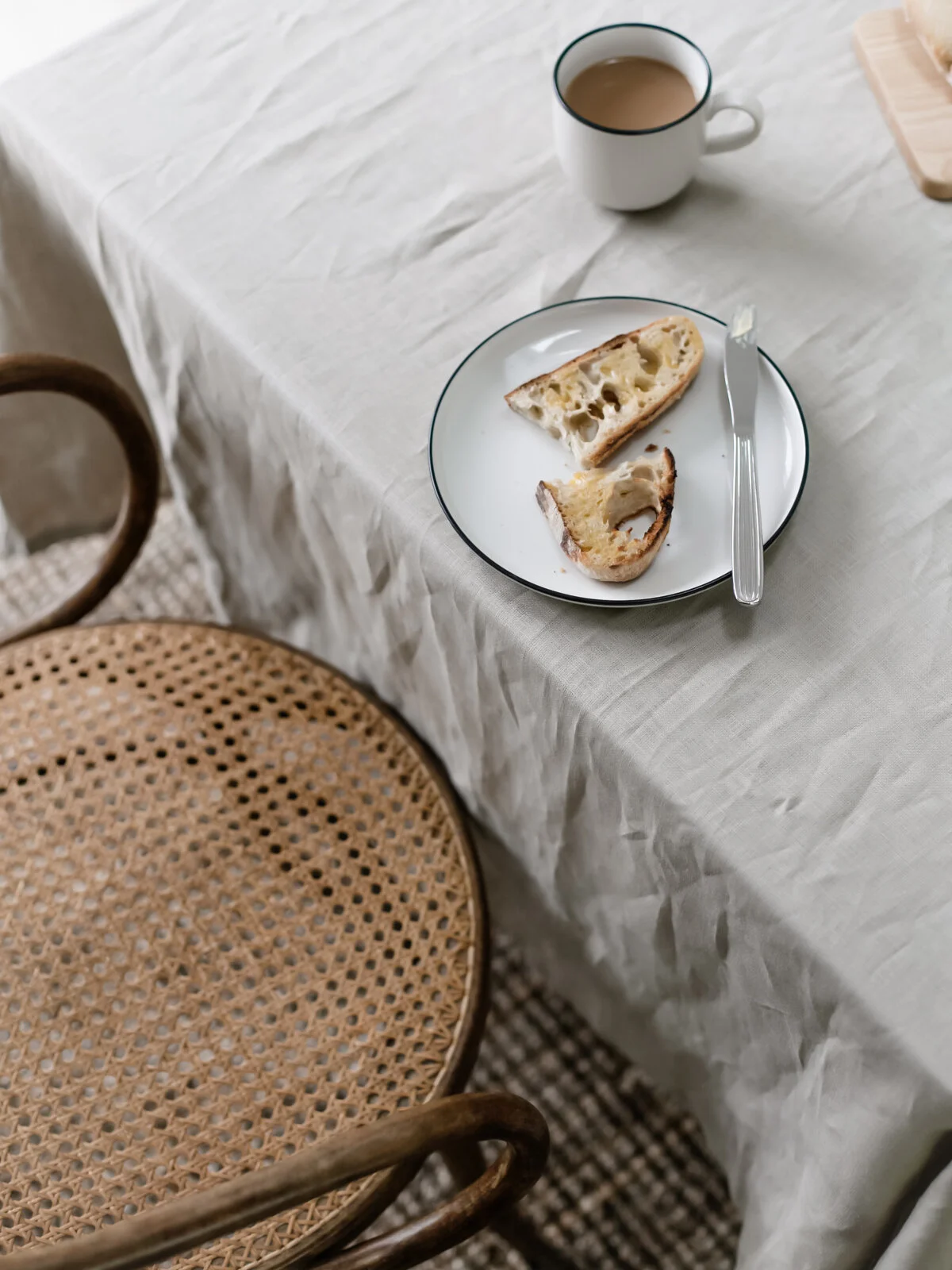 Breakfast table with rattan bentwood chair and sourdough toast.jpg