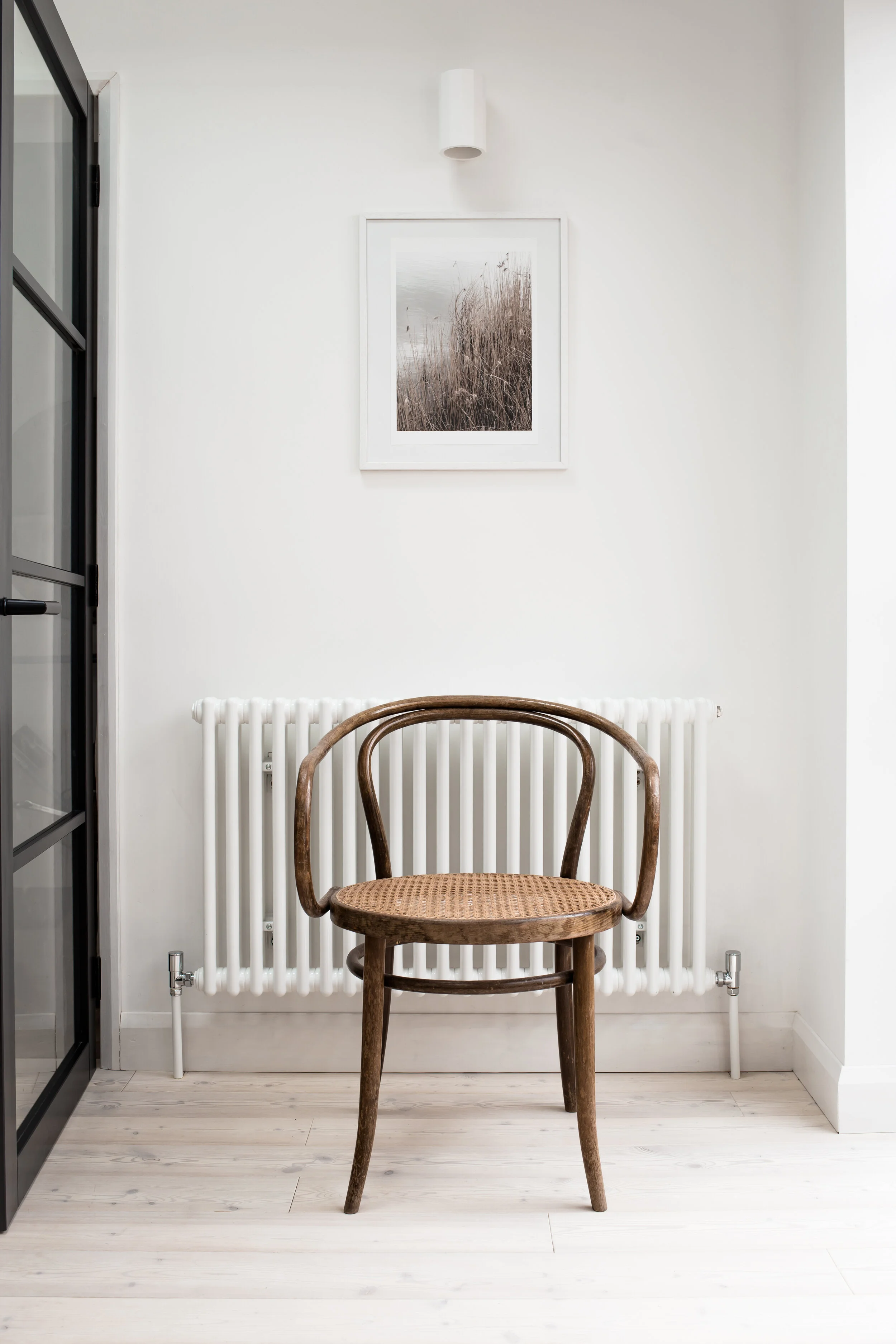 Thonet chair, pale wood flooring and crittall style internal doors - Design Hunter-1.jpg