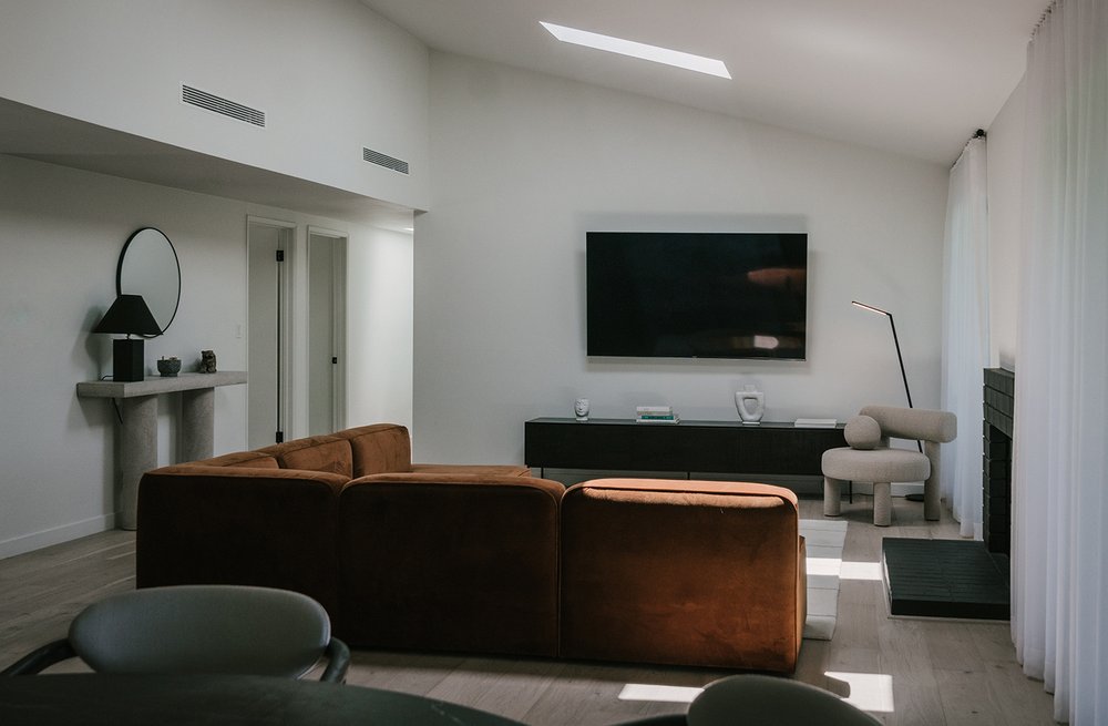 Living room with rust corner sofa