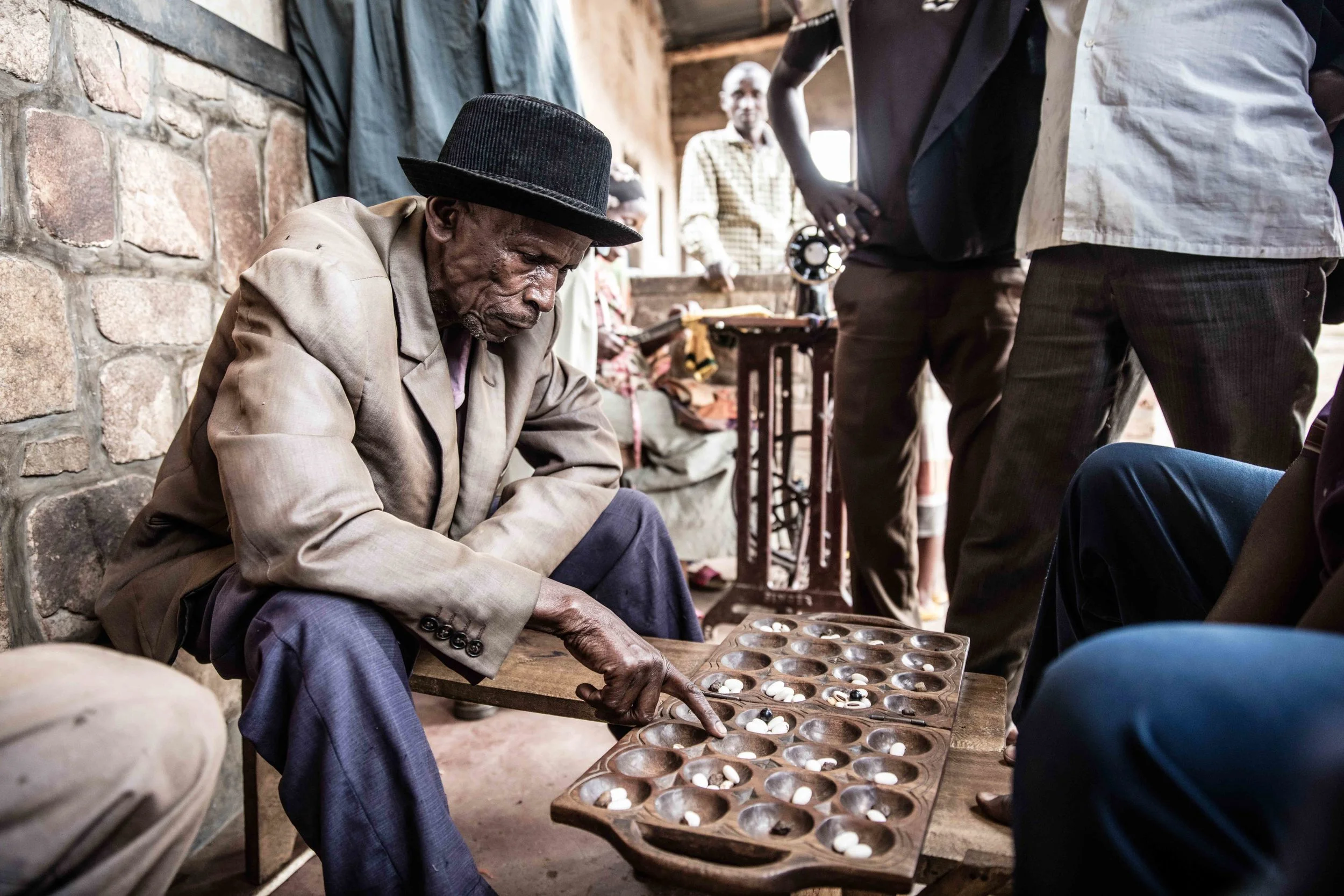 Old man playing mancala (1 of 1).jpg