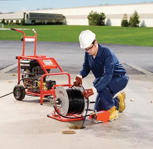 Hydro-Jet Hydro jetting consists of a high-pressure hose with a specialized nozzle connected to a machine that pressurizes the water, producing a powerful stream that can cut through minor root blockages and restore the flow of water to the drain field. 