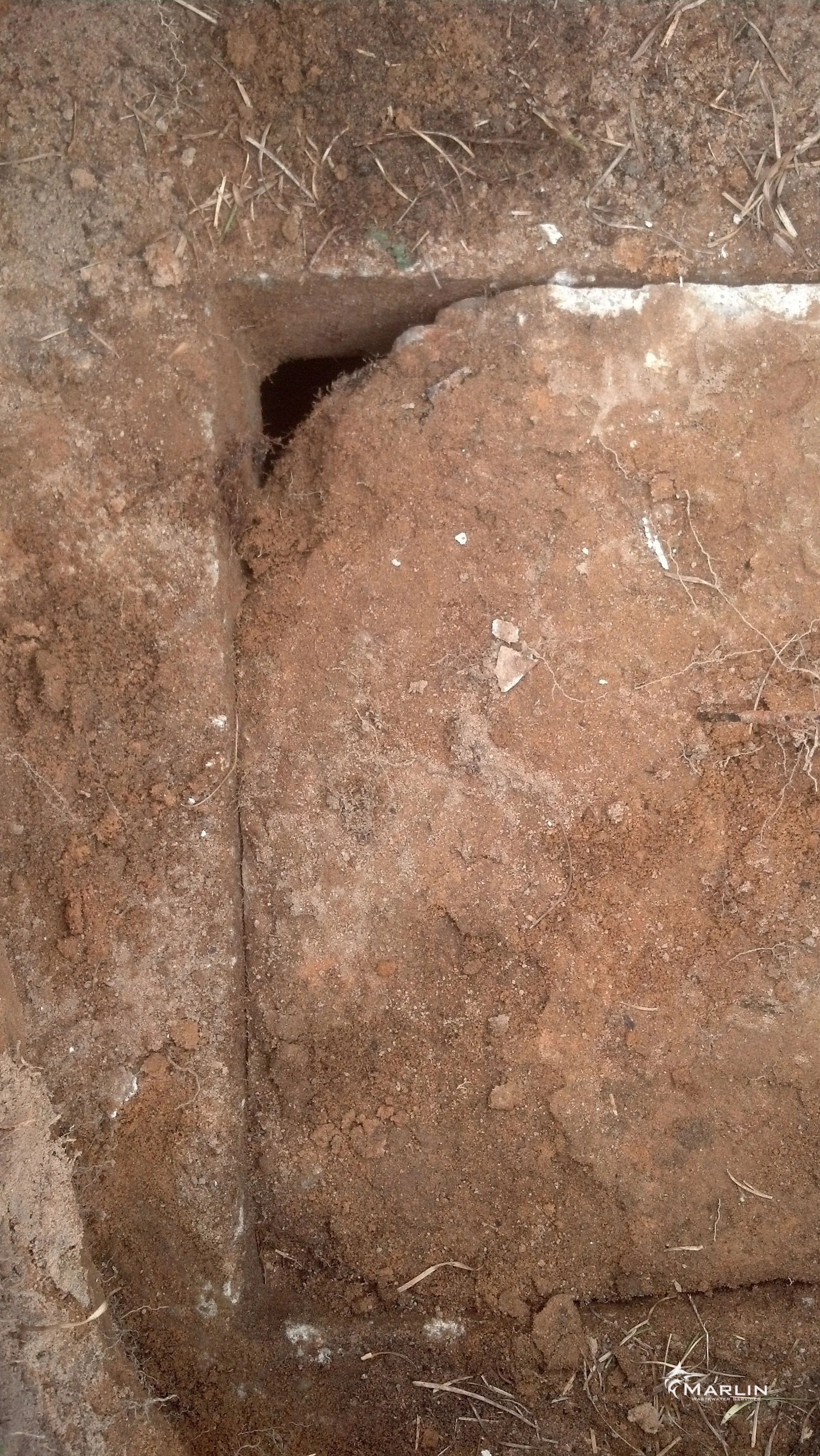 Corner of the Septic Tank Lid is Missing