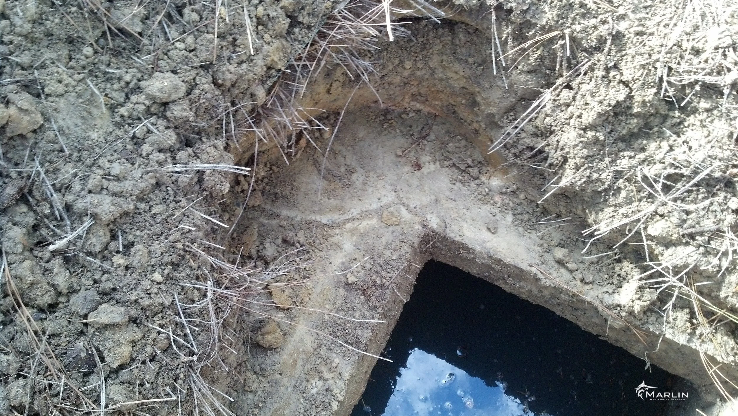 Digging to Follow Crack in Septic Tank Top
