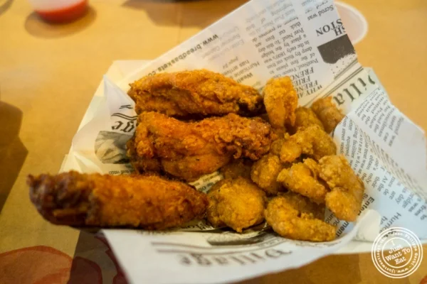 Wings and popcorn shrimp at Claw Daddy's in New York, NY