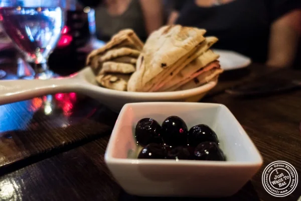 Olives and pita at Pierre Loti Wine Bar in New York, NY