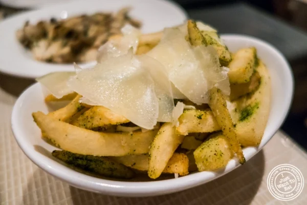 French fries with herbs and shaved parmesan at Maze by Gordon Ramsay in New York, NY