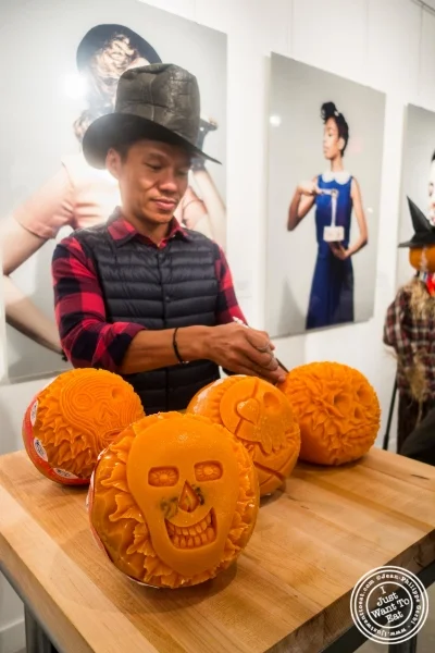 Artist Krai carving mimolette for Halloween at The French Cheese Board