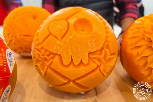 Artist Krai carving mimolette for Halloween at The French Cheese Board
