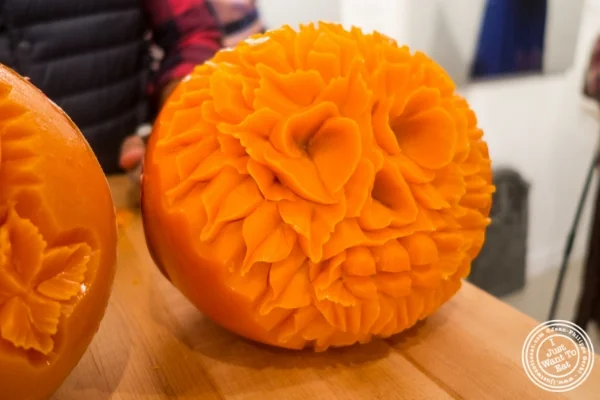 Artist Krai carving mimolette for Halloween at The French Cheese Board