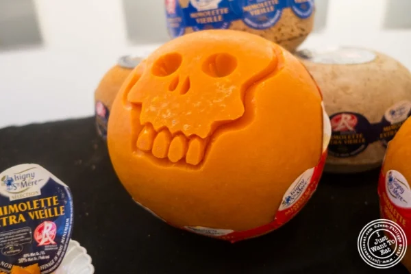 Artist Krai carving mimolette for Halloween at The French Cheese Board