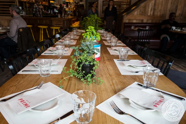 Communal table at Bar Primi in NYC, New York