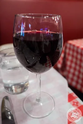 Glass of Bordeaux at Tout Va Bien, French Restaurant in NYC, New York
