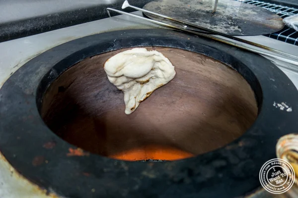 Making nan in a tandoor oven at Surya, Indian restaurant on Bleecker, NYC, New York
