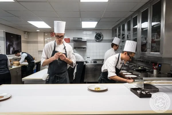 Plating in the kitchen of Eleven Madison Park in NYC, New York