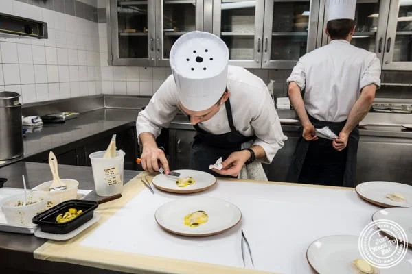 Plating in the kitchen of Eleven Madison Park in NYC, New York