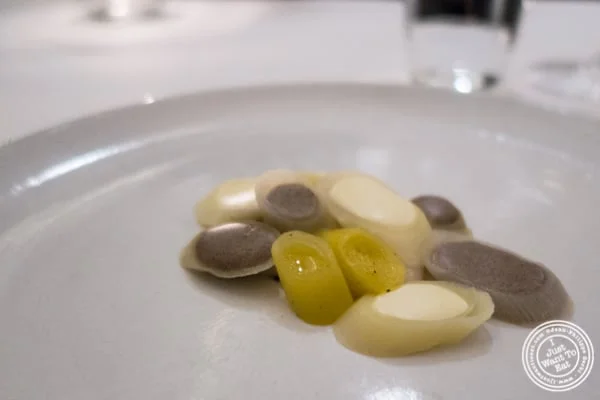 Scallops marinated with leeks and black truffle at Eleven Madison Park in NYC, New York