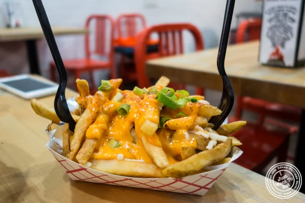Sriracha hinted cheesy fries at IWF - International Wings Factory on the Upper East Side