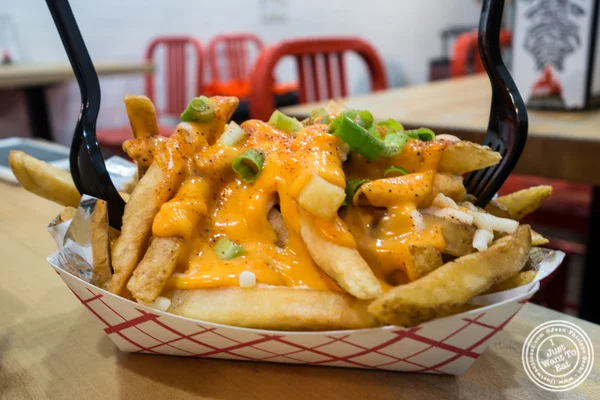 Sriracha hinted cheesy fries at IWF - International Wings Factory on the Upper East Side
