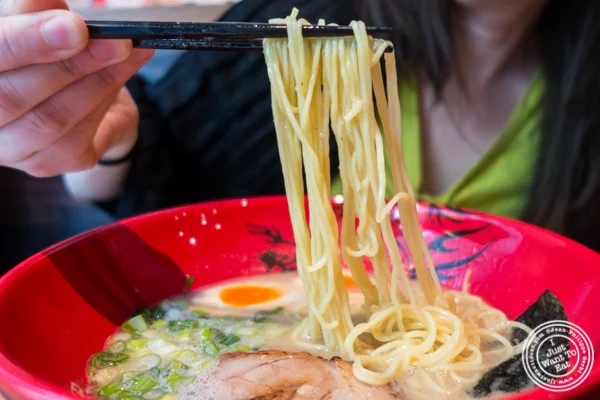 Thin straight noodles in Ajitama ramen at Ramen Zundo-Ya in NYC, New York