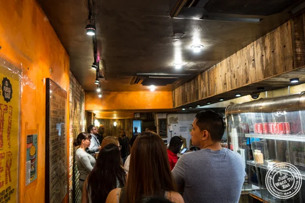 Waiting online to order at The Kati Roll Company in NYC, NY