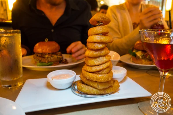 Onion rings tower at 5 Napkin Burger near Union Square, NYC, NY