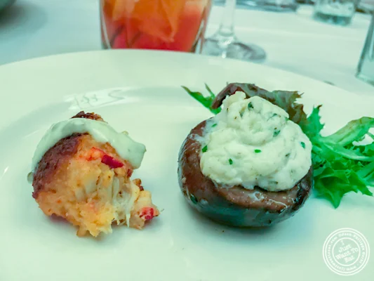 Crab cake bite and stuffed mushroom at The Capital Grille in NYC, NY