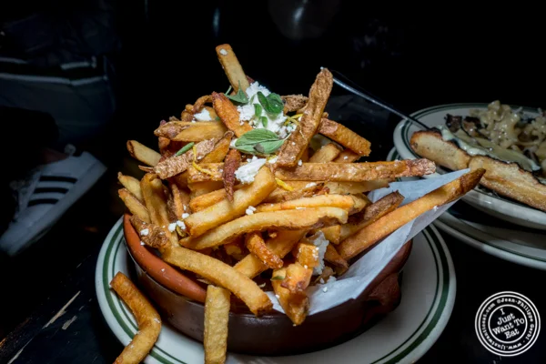 Greek fries at Hanger steak at Antique Bar & Bakery in Hoboken, NJ