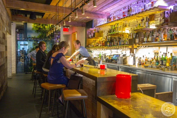 Bar area at Rouge Tomate Chelsea in NYC, NY