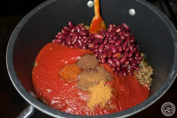 Step 2: add the tomato sauce, beans and spices