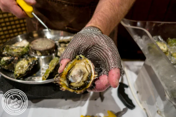 Shucker Paddy wears a stainless steel knife to shuck oysters