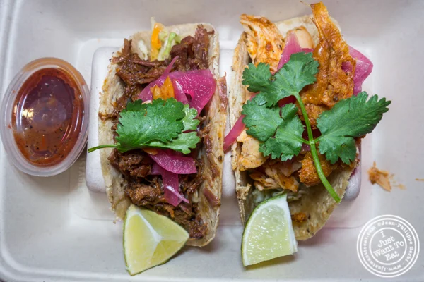 Beef short ribs and rotisserie chicken Tinga tacos at Taco Dumbo in NYC, NY