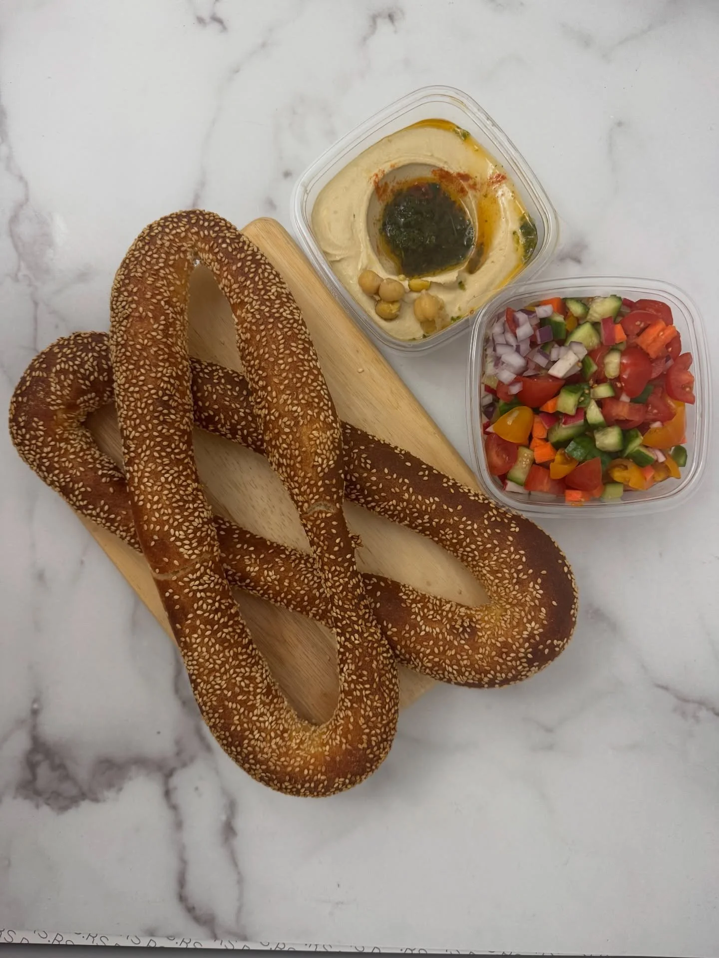One of my favorite things at @breadsbakery, besides the chocolate babka of course, is eating hummus and Israeli salad with a Jerusalem bagel 🥯👅
.
.
.
#ijustwanttoeat #bagel #hummus