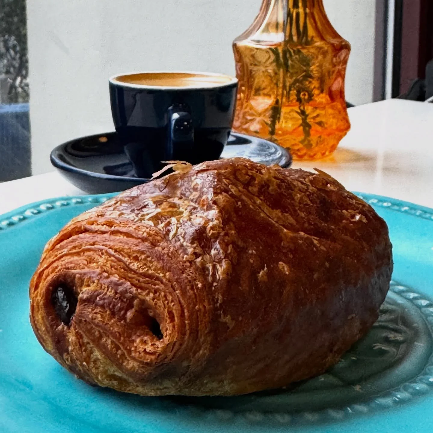 Ever wonder what a perfect Saturday morning in Hoboken tastes like? 🌿☕ Spoiler: it starts with one of these. 😍 The iconic chocolate croissant from @chocopainbakery &mdash; a crispy, flaky croissant dough wrapped around two dark chocolate batons, ma