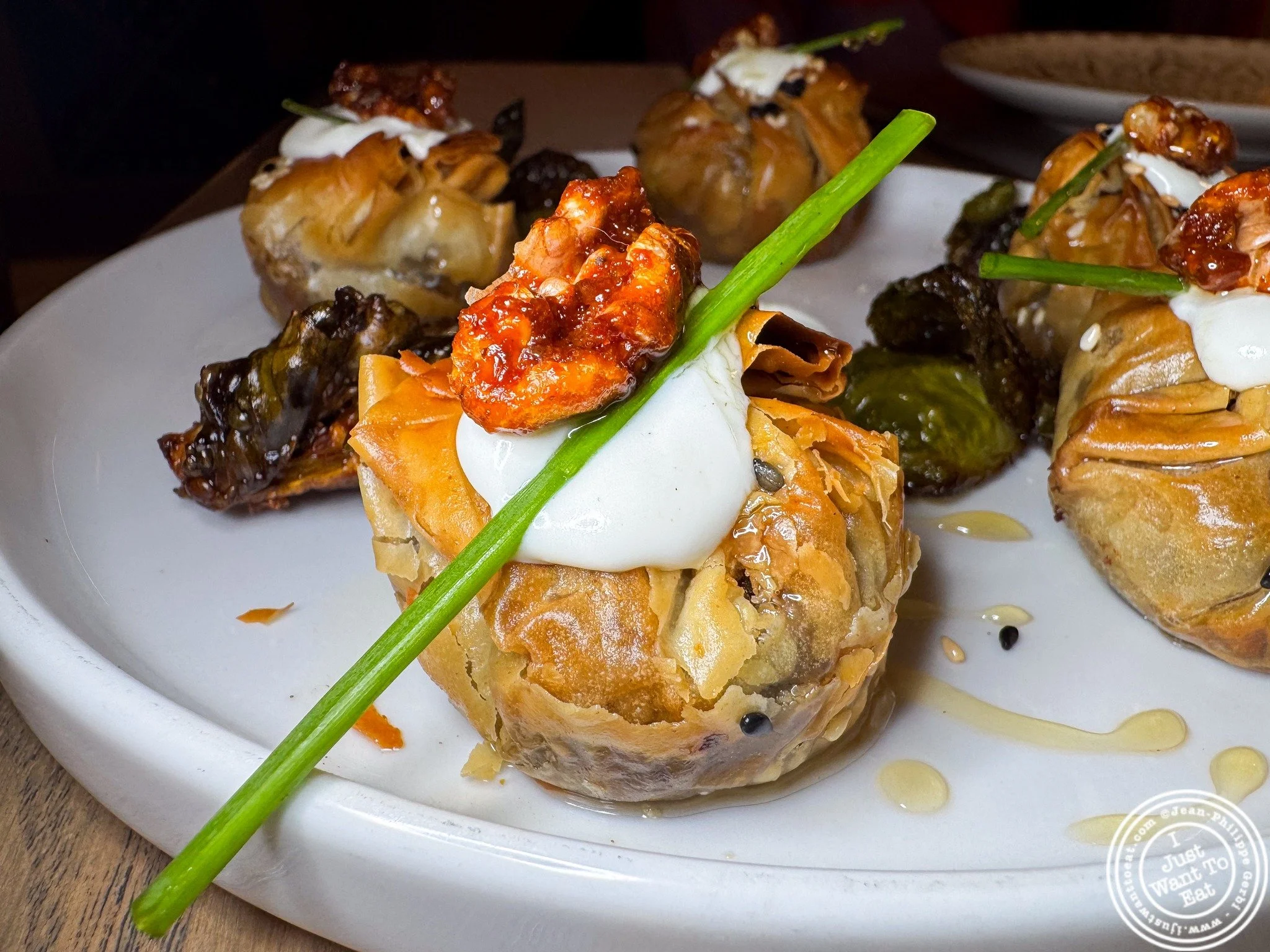 Wow 😍 Had the most surprising and delicious bite at @solazmediterranean in Jersey City! Their baklava bites are a flavor adventure: mushrooms + Brussels sprouts tucked into a deep‑fried kataifi pocket, topped with creamy goat cheese and a drizzle of