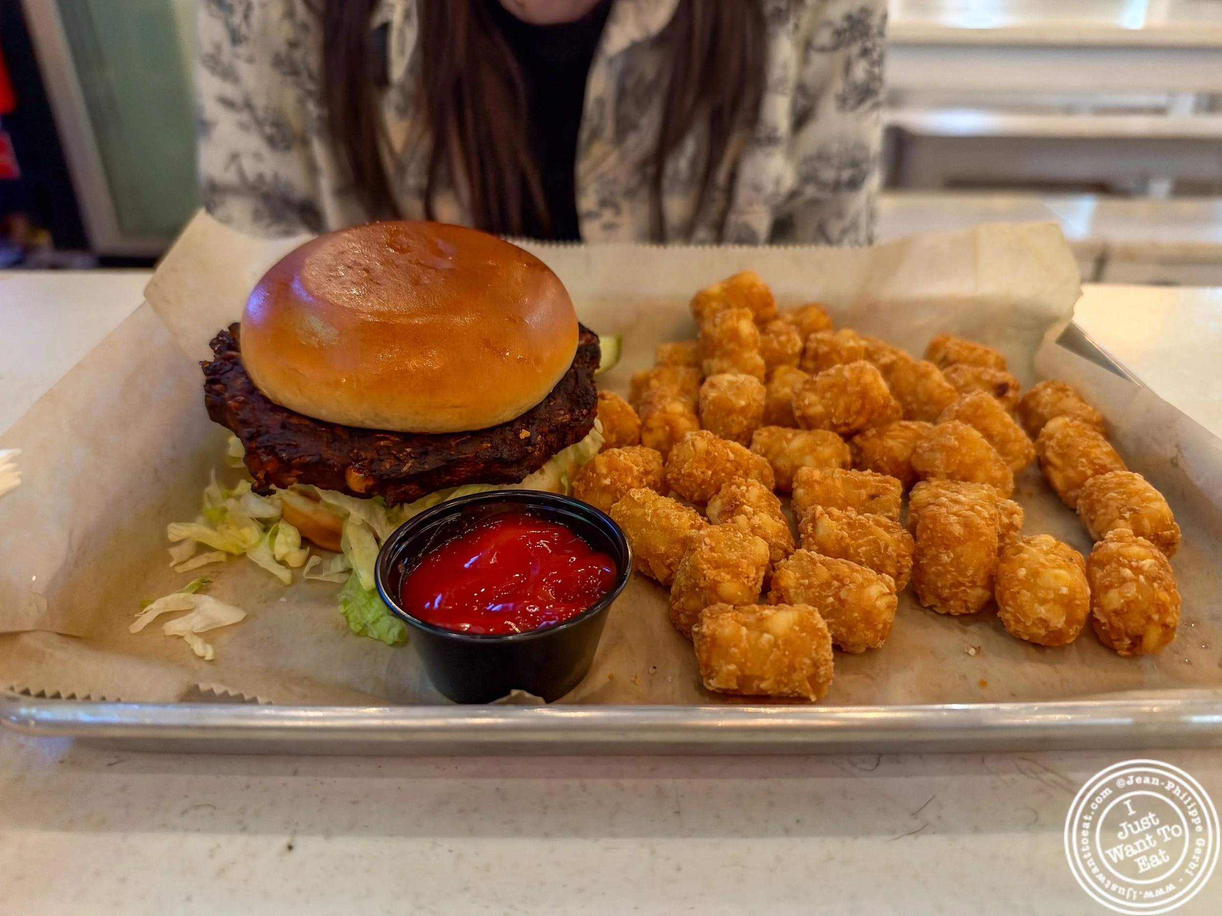 Veggie burger and tater tots at Clinton Hall FiDi in NYC, NY