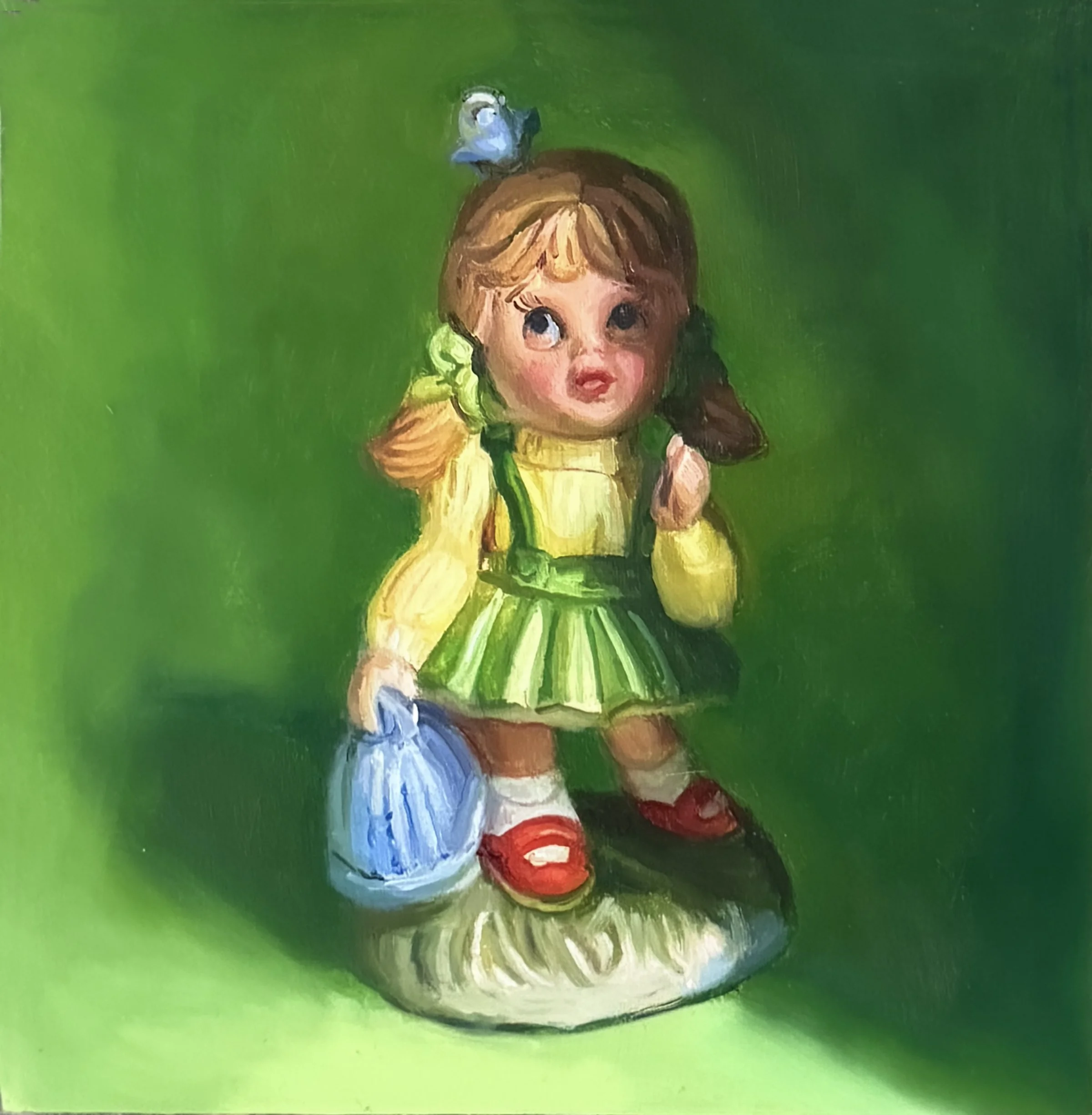 available girl with bird cage figurine.jpg