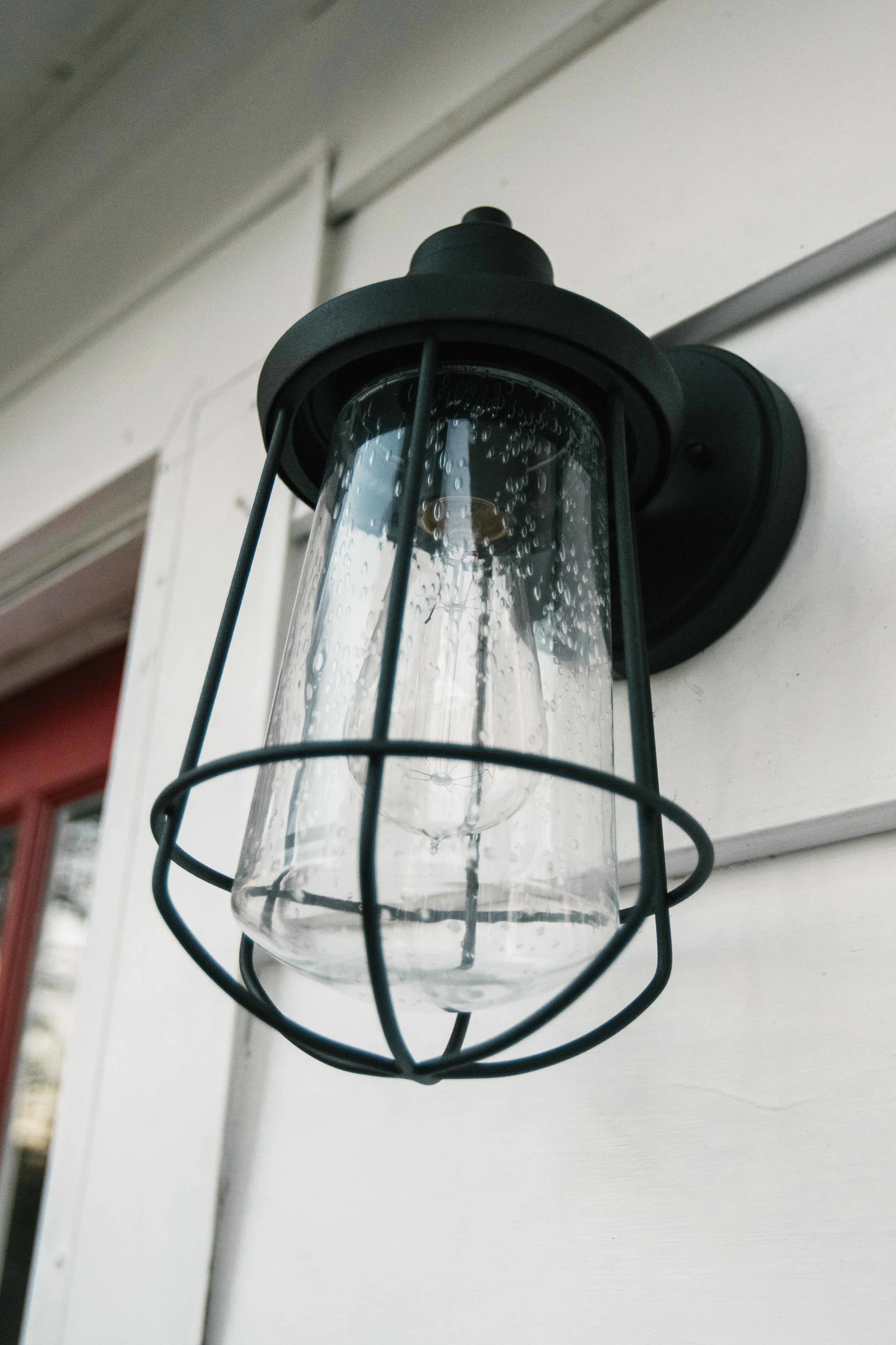 Matt and his dad installed a couple new sconce s outside of our front door - when in Rome... or a Cape Cod bungalow.... 