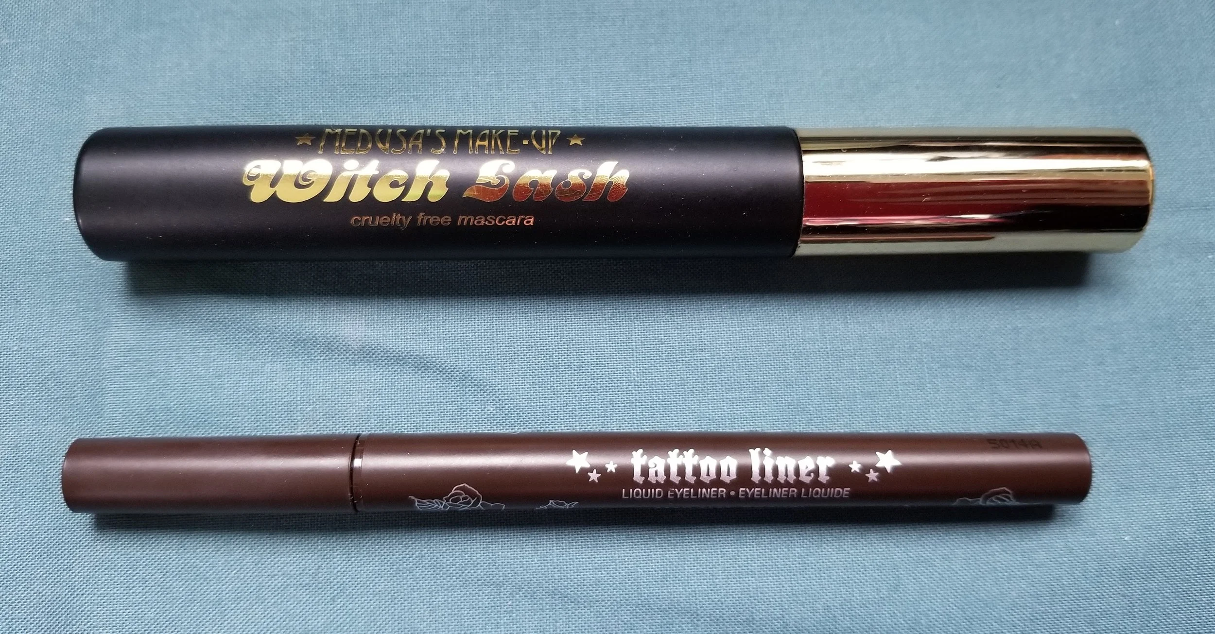 I originally had an orange tube of mascara from Essence in the pile (you can see it in that first pic) but it started getting clumpy and dry in the past day or so. So I pitched it and replaced it with the Medusa's Makeup Witch Lash you see above. The Kat Von D liner might only have a few more uses - I've had it so long I can't believe it didn't dry out sooner! 