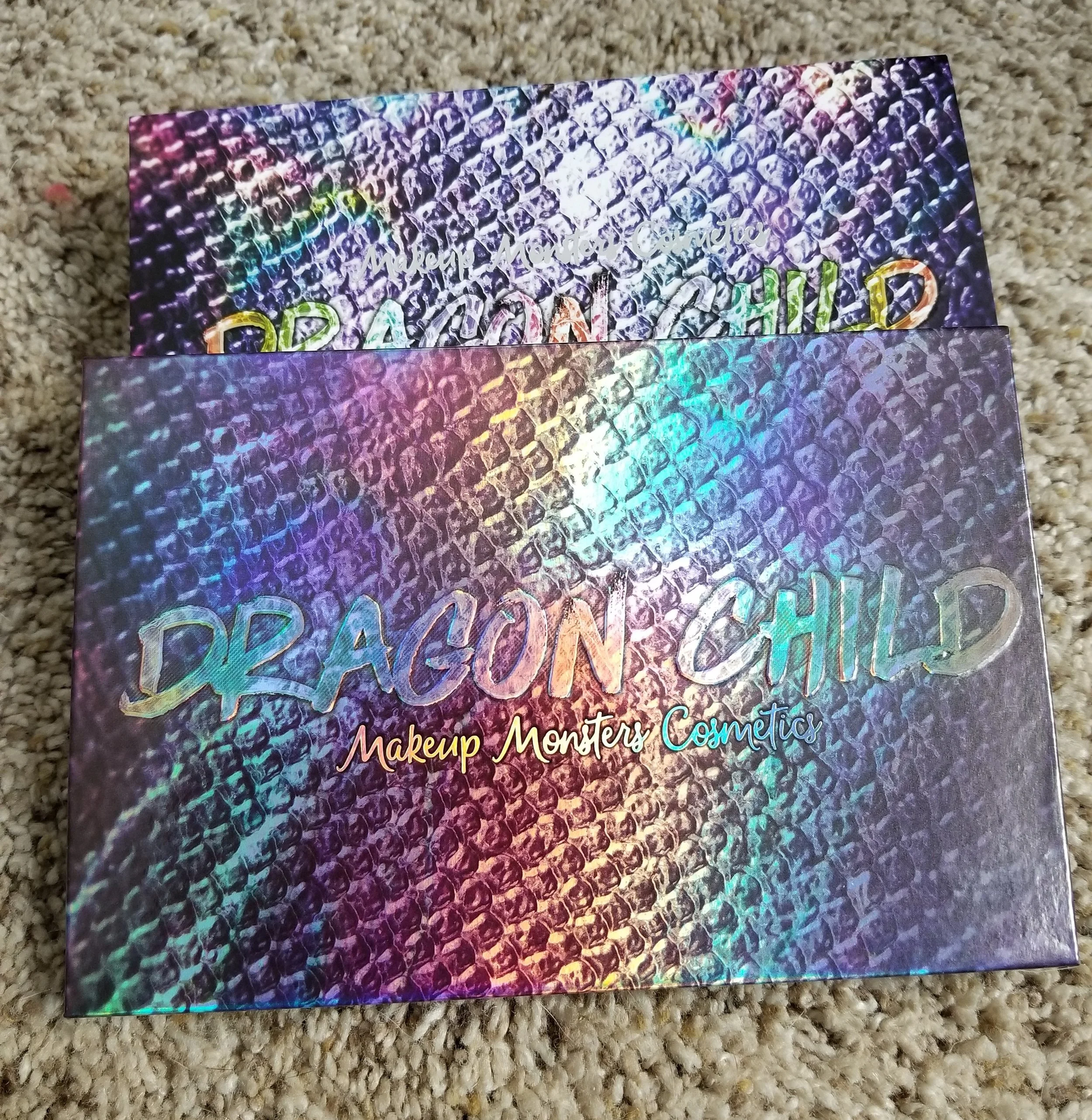 The palette is up front with the matching sleeve in the back. Both holographic. Both cool.
