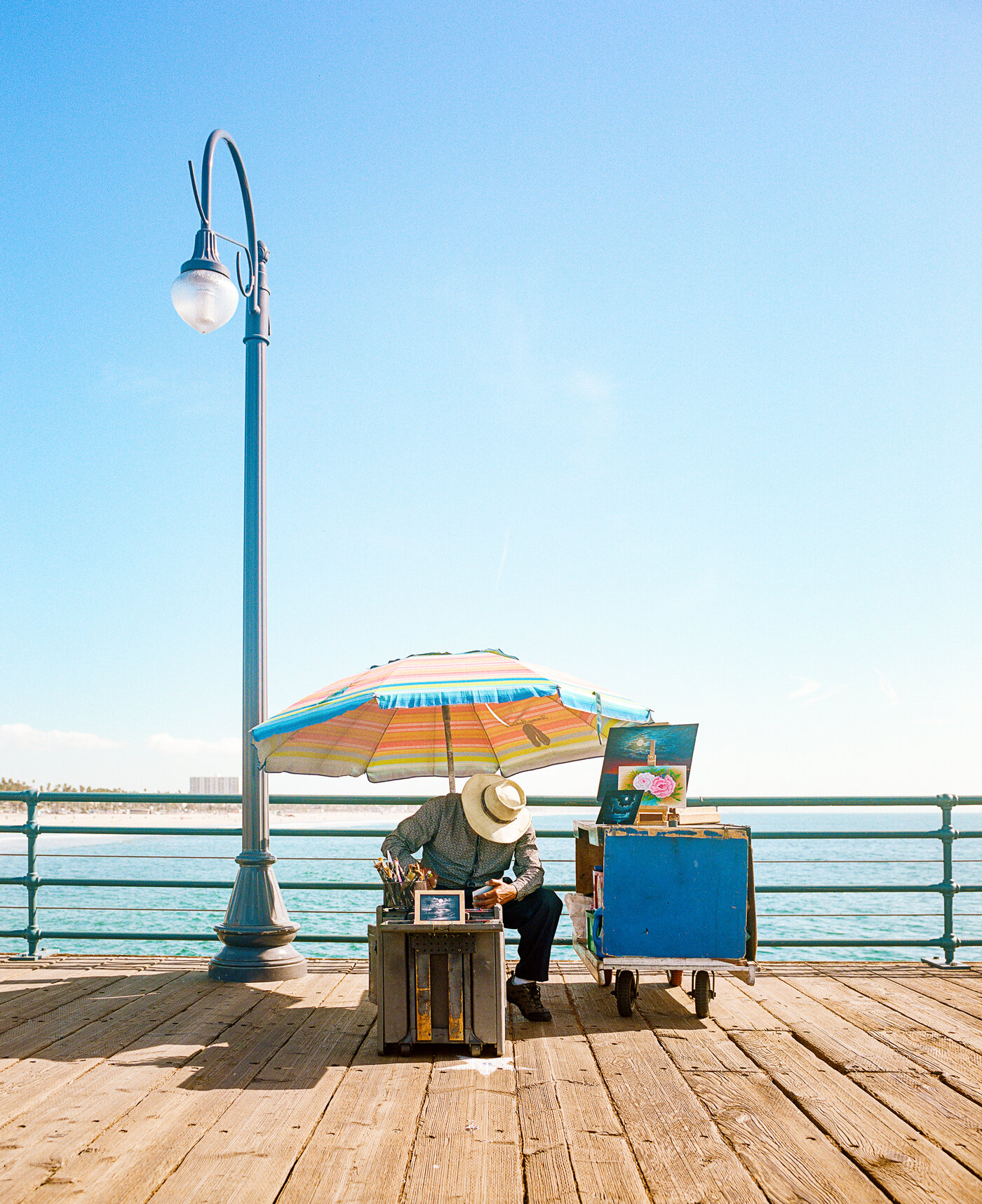 2020_California_Santa_Monica_Pier_Man_Painting_RJS_000053170006.jpg