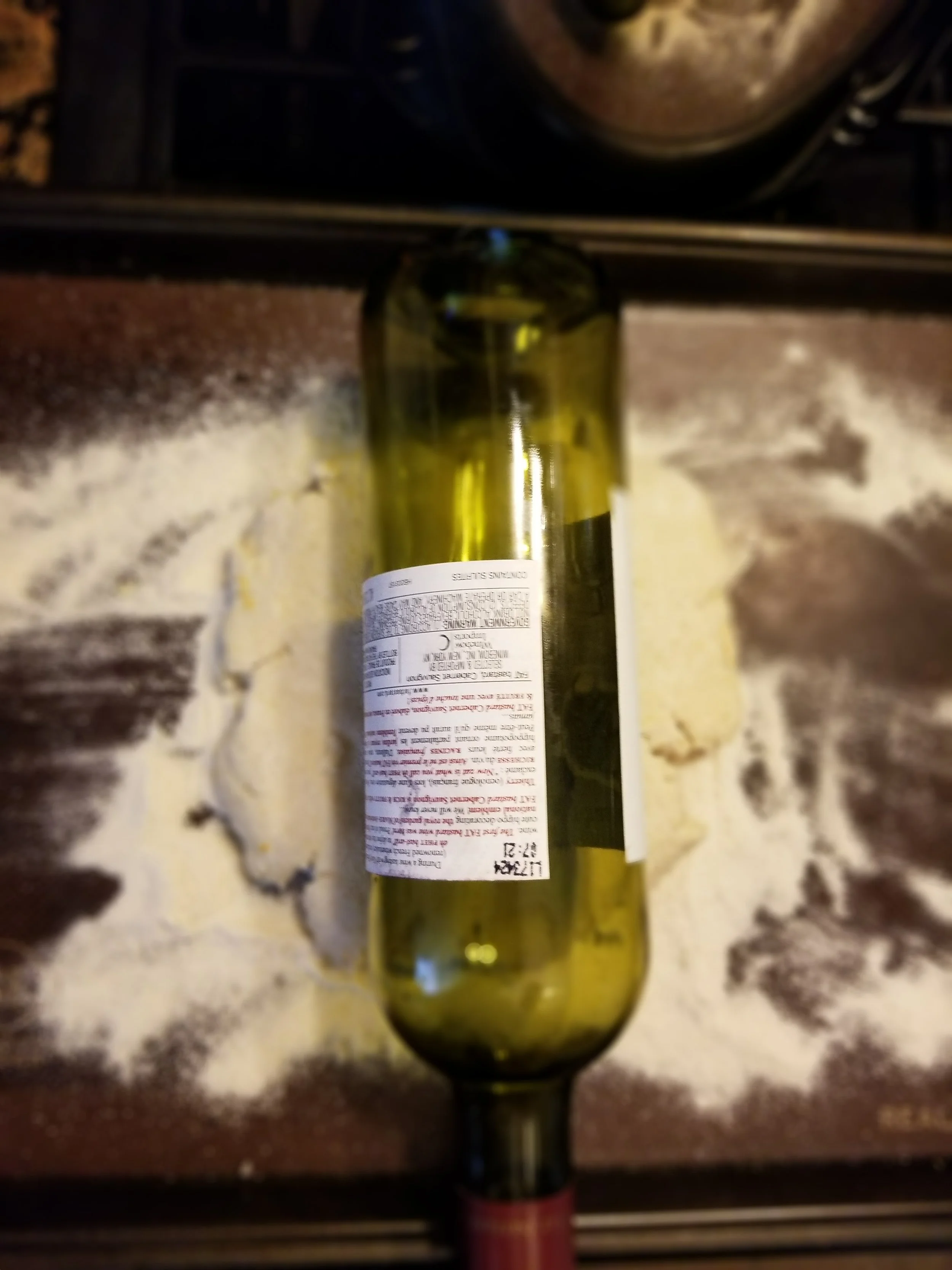 Roll your dough to 1/4” thick. I prefer a wine bottle because it rolls over the edges of the sheet.
