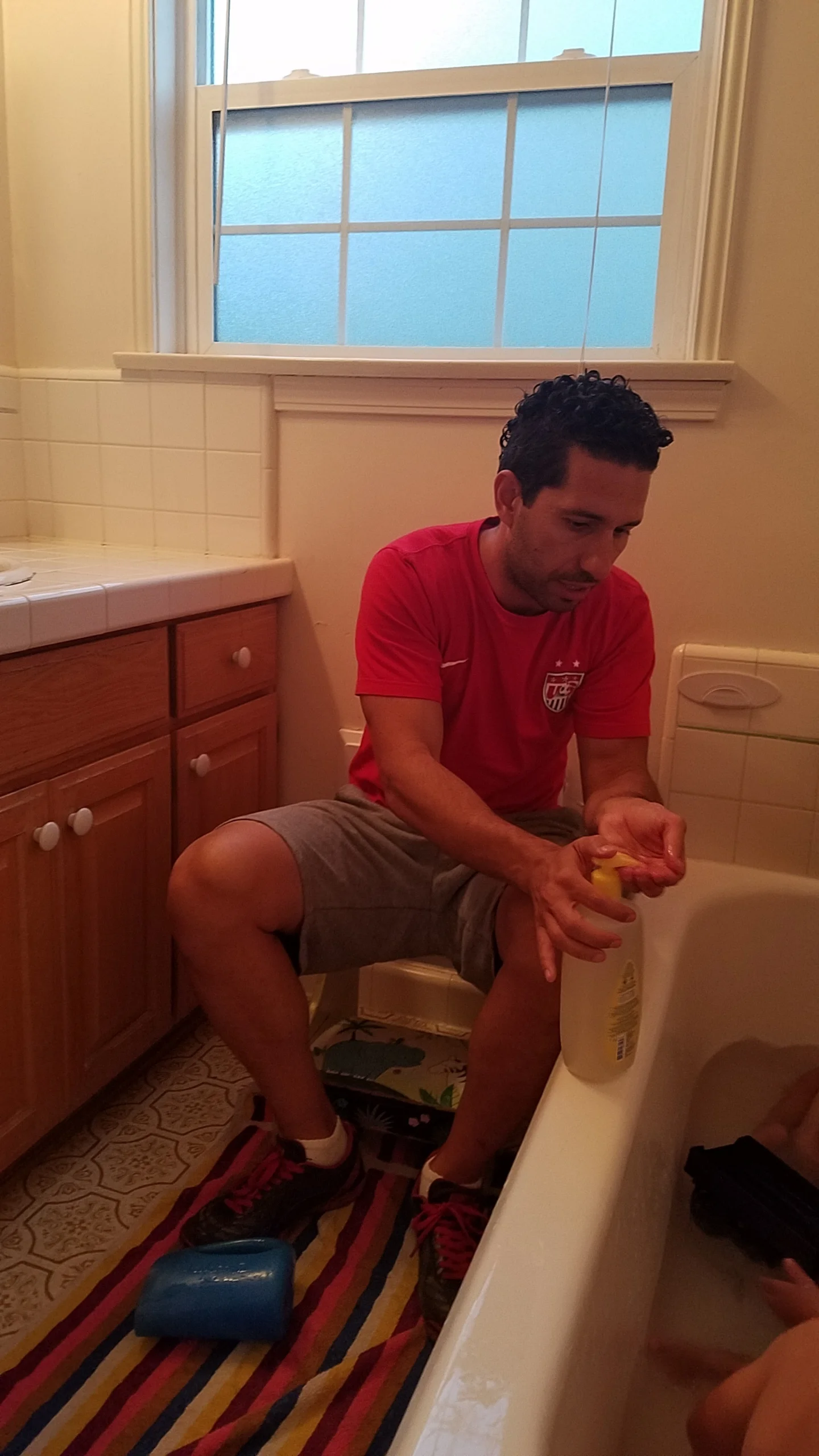 Sassoon hard at work getting the right amount of soap bubble level in the bath.
