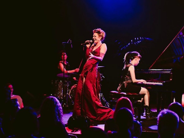 Anya Anastasia in flight as Rogue with Laurie Black on keys and Bec Matthews on drums.