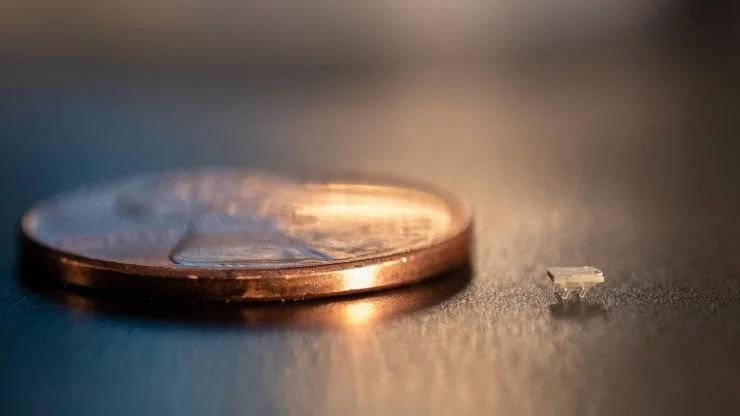Comparison of a micro-bristle-bot to a coin